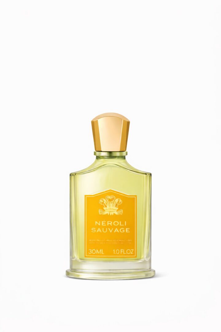 Elegant bottle of Herbal Essence perfume with gold cap.