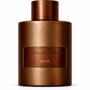 A sleek brown bottle of Paco Rabanne perfume with a copper-toned cap.