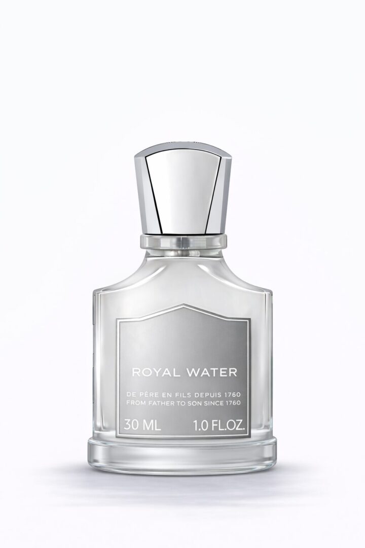 Clear glass bottle of floral water with silver cap.