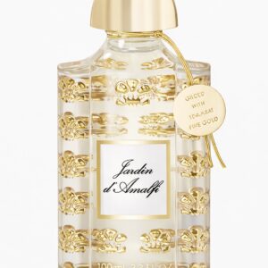 Elegant Guerlain Shalimar perfume bottle with gold accents.