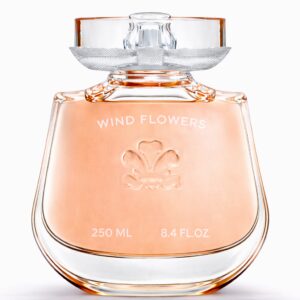 Elegant perfume bottle with peach-colored fragrance inside.